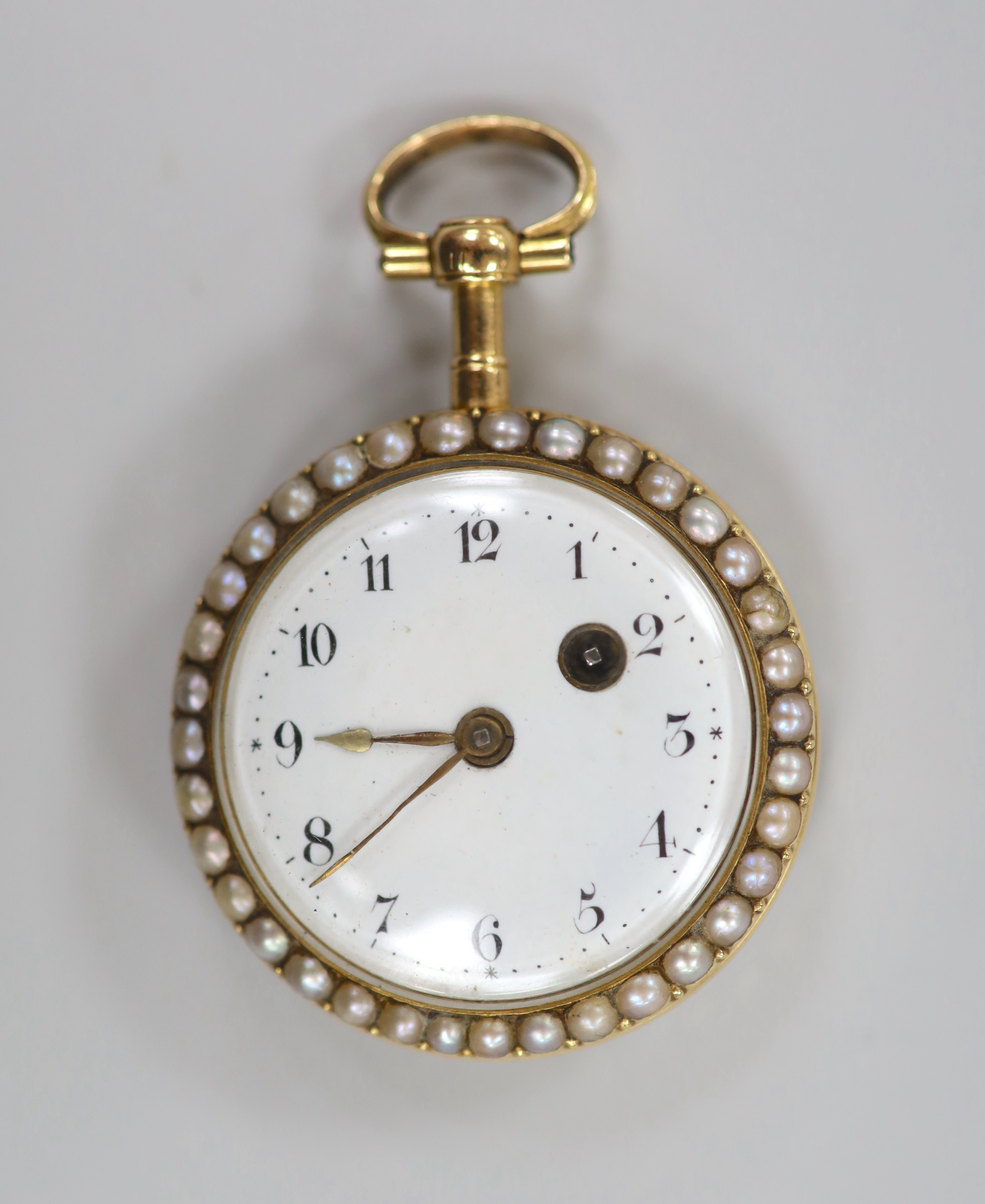 An early 20th century continental yellow metal, split pearl and enamel set open face fob watch, with Roman dial, case diameter 34mm (chip).